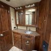 PRE-OWNED 2014 Logan Coach RAZ4GNHDLQ 40' 4 horse Razor GN Horse Trailer**WITH WALK IN CLOSET**